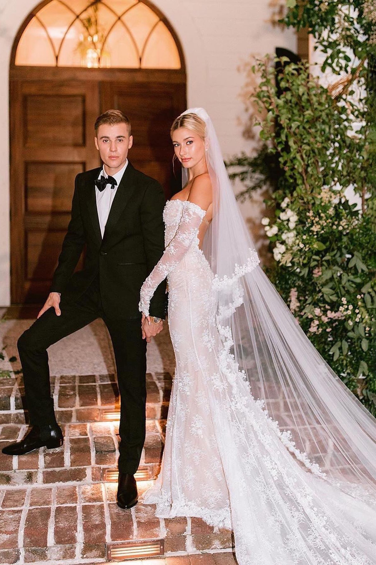 <p><em>Image credits: Instagram.com/mindyweiss. From <a href="https://www.vogue.com.au/brides/news/everything-hailey-bieber-wore-during-her-wedding-week/image-gallery/47da149bd0d499abda059b97df56ac83" target="_blank" rel="noopener">everything Hailey Bieber wore during her wedding week</a></em></p><h2>Hailey Bieber in Off-White</h2><p>In 2018, Hailey&rsquo;s bridal wardrobe consisted of 6 separate looks&mdash;a rehearsal look, a bridal gown, two reception dresses, her evening look and a post-wedding pantsuit for the following day. When Bieber finally said &lsquo;I do&rsquo;, she did it in opulent style, wearing an Off-White off-the-shoulder gown designed by the late Virgin Abloh. The mermaid style-cut, boned bodice and intricate lace embroidery called for a more traditional approach to wedding dress, one Abloh and his brand are not usually noted for. However, the designer did not fully omit his signature aesthetic as the gown was detailed with Off-White&rsquo;s logo as well as the text &ldquo;Wedding Dress&rdquo; embroidered in pearls on the back of the gown. &ldquo;To death do us part&rdquo; was also branded on the back of the veil as Hailey walked down the aisle. The model&rsquo;s first reception look was a Vera Wang number paired with sneakers, and for her second&mdash;a Ralph and Russo floor-length gown.</p>