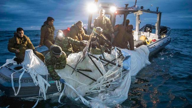 US Navy sailors recover a high-altitude Chinese surveillance balloon off the coast of Myrtle Beach, South Carolina. Picture; US Navy/AFP.