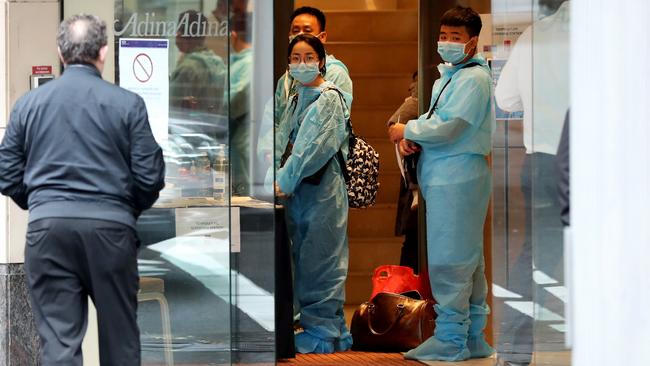 A Unified Security guard mans the entrance to the Adina quarantine hotel. Picture: Jonathan Ng