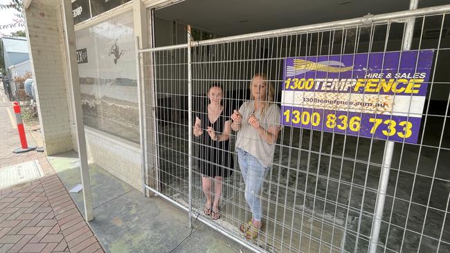 Deja Vu Mannum owner Kylie Rochow and staff member Jemma Gurr inside the empty store as the clean up begins. Picture: Dylan Hogarth.