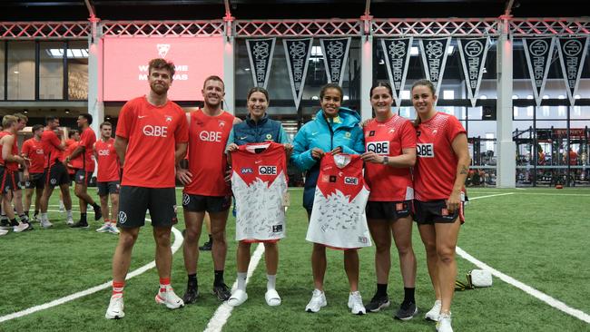 Swans Dane Rampe and Luke Parker, Matildas Steph Catley and Mary Fowler, and Sydney AFLW players Lucy McEvoy and Chloe Molloy.