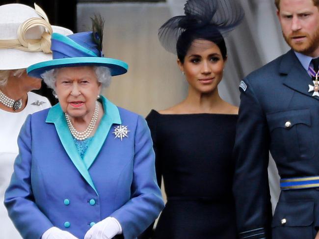 Queen Elizabeth II with Prince Harry and Meghan Markle. Picture: Tolga Akmen/AFP