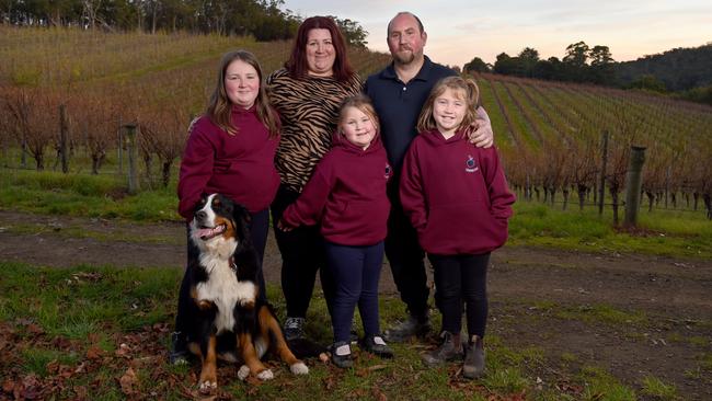 Burn victim Shayne Boyle suffered 33 per cent burns as a result of fighting the fires. However, he’s recovering well thanks to the support of his wife Jess and their daughters (L-R) Jemima, 10, Matilda, 6, and Chelsea, 8 and their dog Indy. Picture: Naomi Jellicoe.