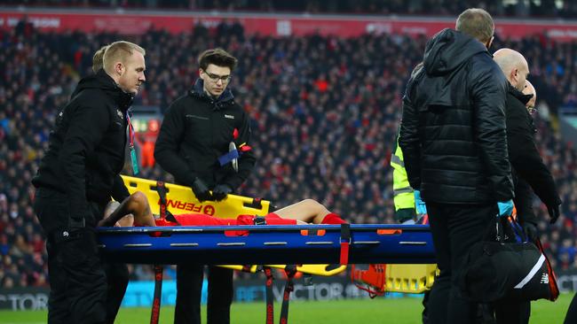 Philippe Coutinho of Liverpool is taken off by a stretcher.