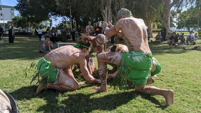 Indigenous men perform a smoking ceremony at the Black Lives Matter Rally in Townsville.