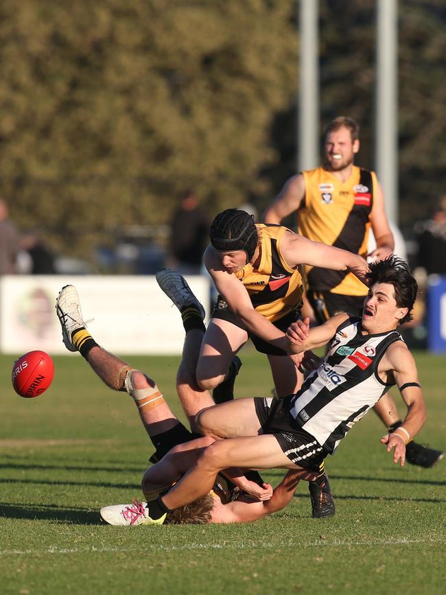 Bannockburn's Austin Mahoney ends up at the bottom of the pile as North Geelong's Noah Penny comes in from the side. GDFNL North Geelong v Bannockburn. Picture: Alan Barber