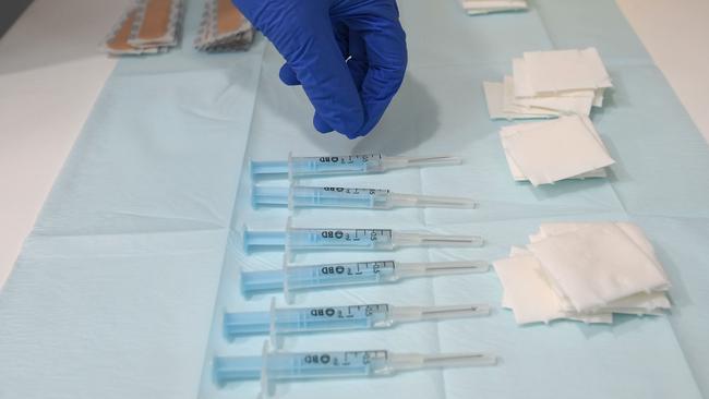 A nurse picks a syringe containing a dose of the AstraZeneca's Covid-19 vaccine at a vaccination center in Barcelona. Picture; AFP.