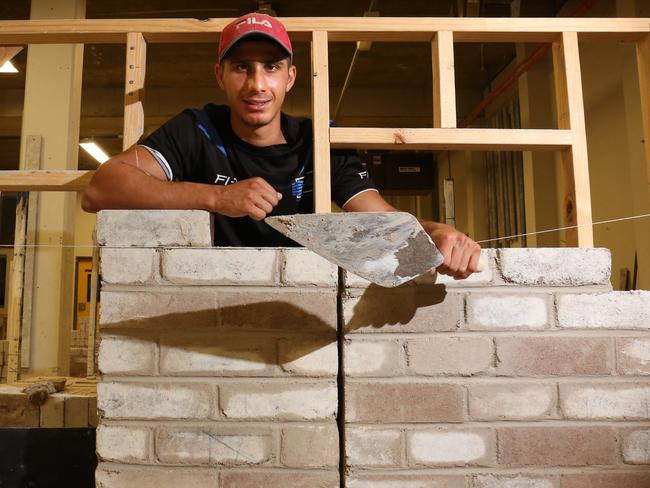 A workforce of highly skilled people like award-winning bricklaying apprentice Anthony Gargoura will be the key to Australia getting back on track. Picture: Robert Pozo/AAP