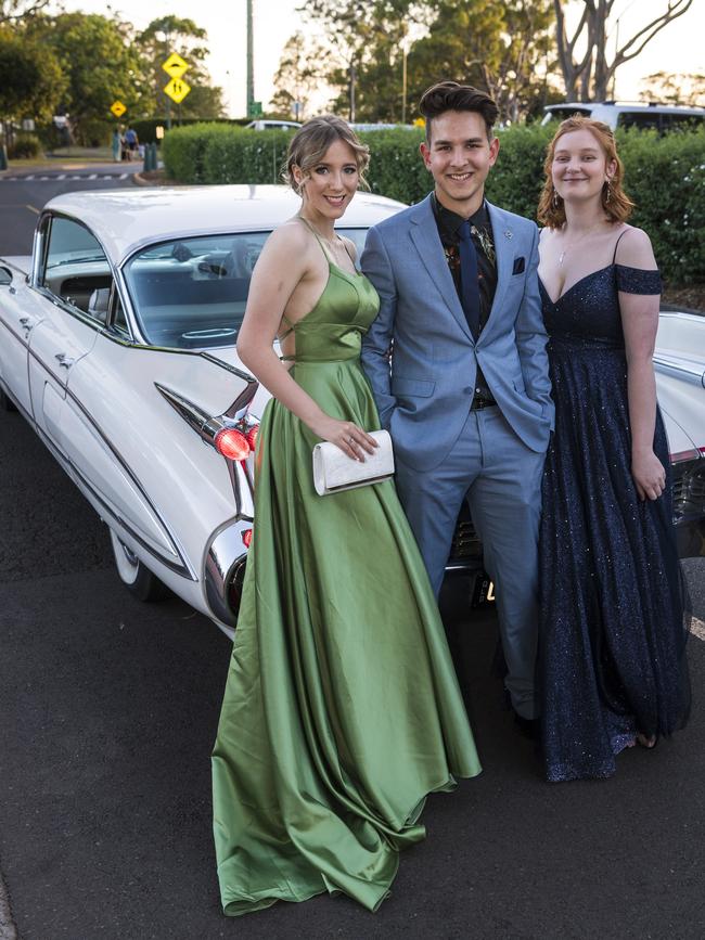 Micah Adamson with Chelsea Machulka (left) and Olivia Hanslow at Centenary Heights State High School formal at Picnic Point, Friday, November 20, 2020. Picture: Kevin Farmer