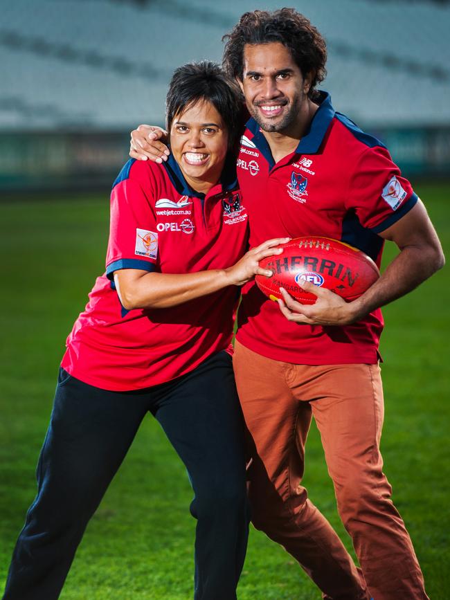 Football coach Bronwyn Davey pictured in 2013 with her brother, Melbourne 's Aaron Davey, before the first ever women’s AFL match, held at the MCG. Picture: FILE.