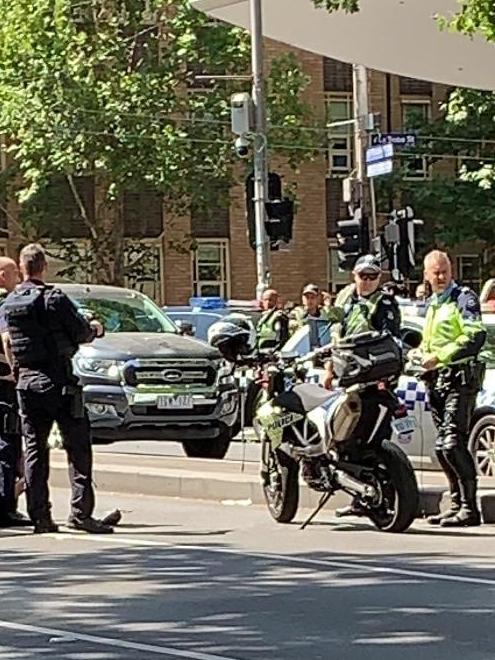 Police at the corner of Russell and Collins streets. Picture: Reddit/ dyii95