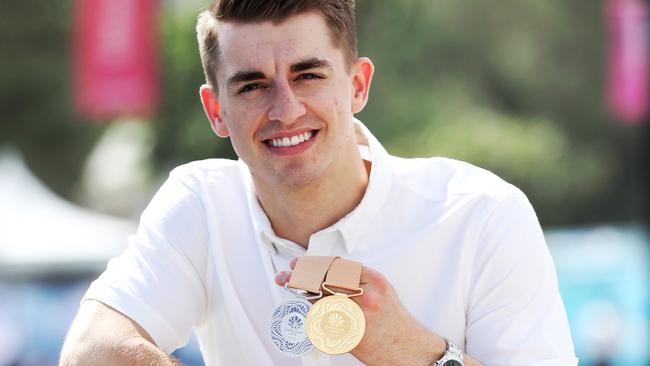 Olympic and World champion gymnast Max Whitlock with his medal haul from the Gold Coast Commonwealth Games. Picture: Nigel Hallett