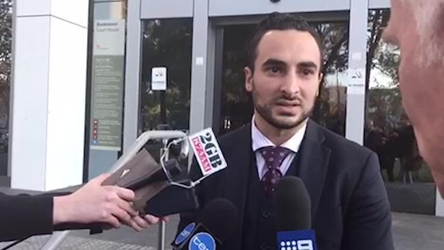 Supporters and lawyer of Osama Hawat outside court today