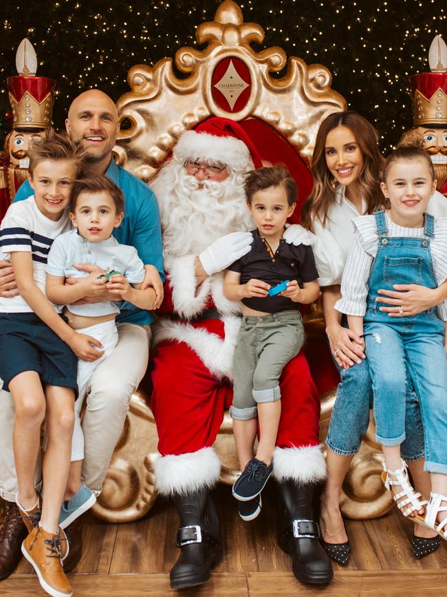 Oscar, Chris, Tom, Darcy, Bec and Billie Judd with Santa.