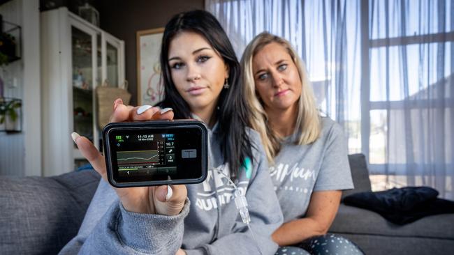 Ange Liston-McCaughley and her daughter Lila with her T-Slim insulin pump. Picture: Jake Nowakowski.