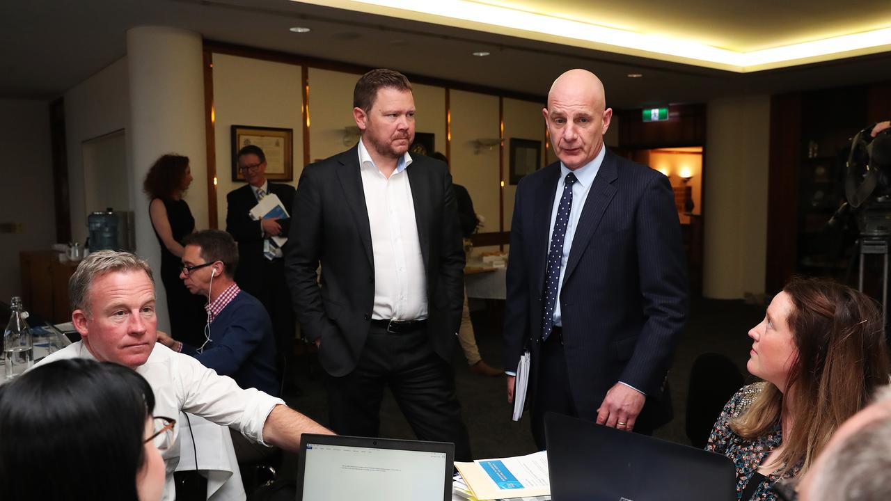 Treasurer Peter Gutwein (standing) with Chris Jones Editor The Mercury while Premier Will Hodgman speaks with The Mercury political team. Tasmanian State Budget 2019. Picture: NIKKI DAVIS-JONES