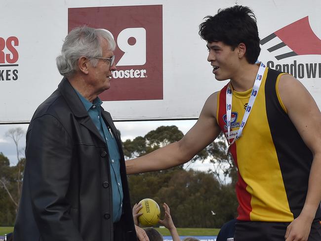 Josh Lair accepts his medal after the Southern football league grand final. Picture: Andrew Batsch