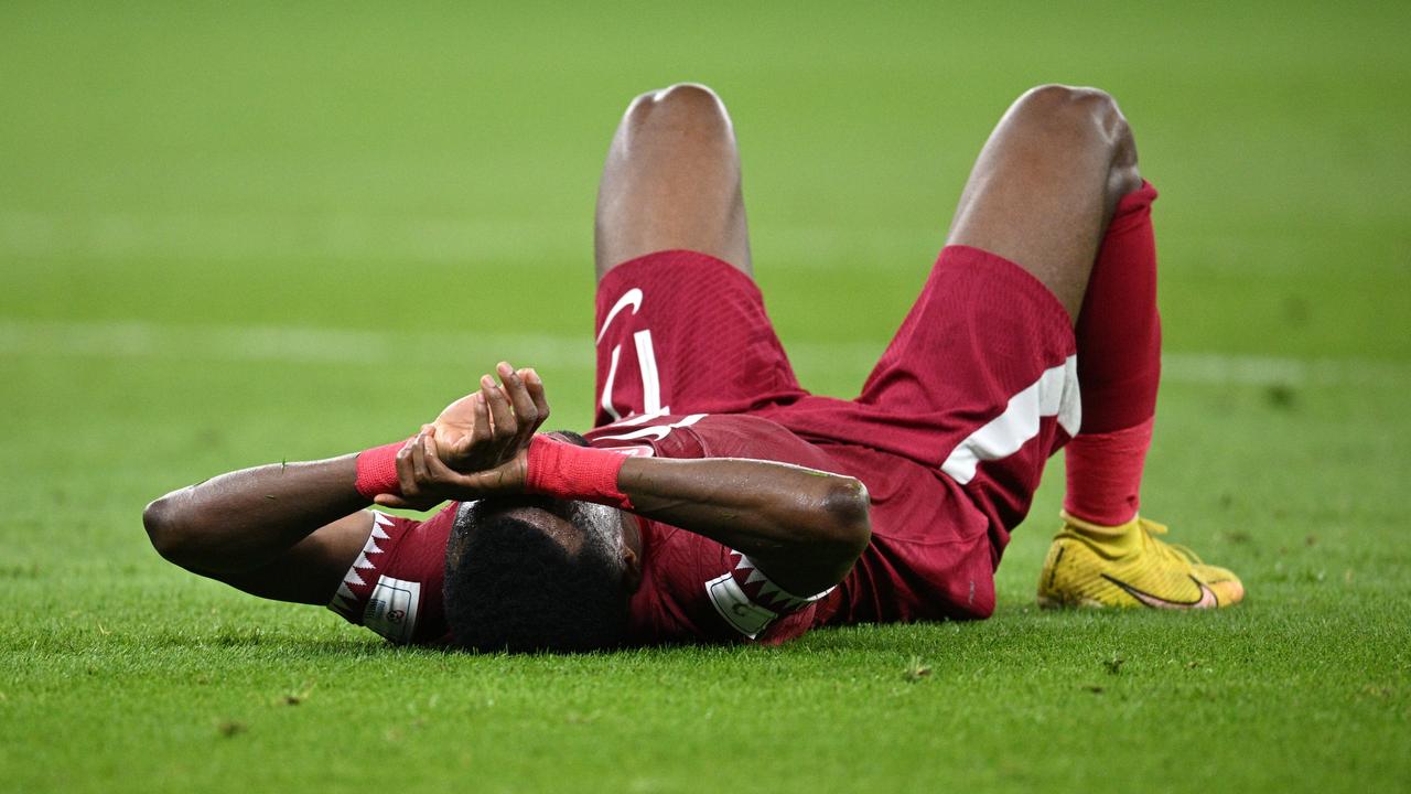 DOHA, QATAR - NOVEMBER 25: Ismail Mohamad of Qatar reacts after the 1-3 loss during the FIFA World Cup Qatar 2022 Group A match between Qatar and Senegal at Al Thumama Stadium on November 25, 2022 in Doha, Qatar. (Photo by Stuart Franklin/Getty Images)