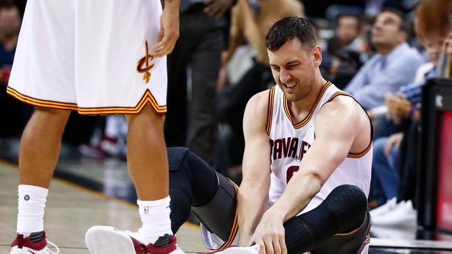 Andrew Bogut in pain after breaking his leg in his first game for Cleveland Cavaliers.