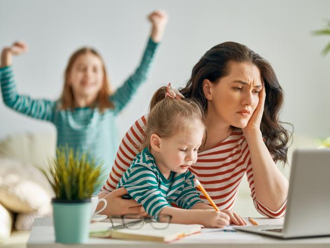 Beautiful woman working on a laptop at home. istock image