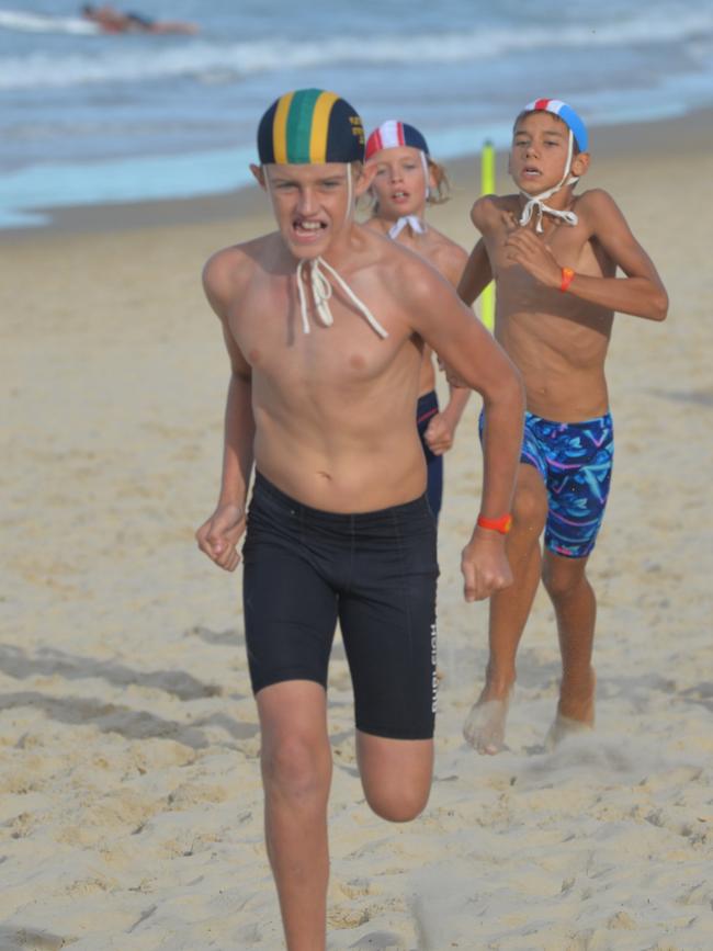 Running action at the Queensland Youth Surf Life Saving Championships on February 17.