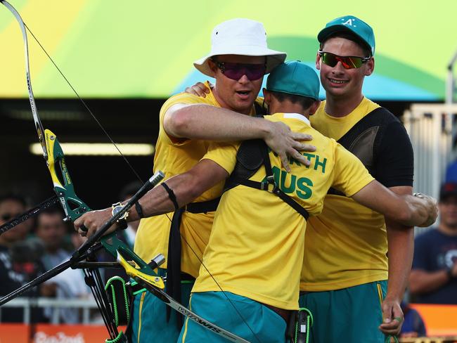 Ryan Tyack, Taylor Worth and Alec Potts celebrate their win over China.