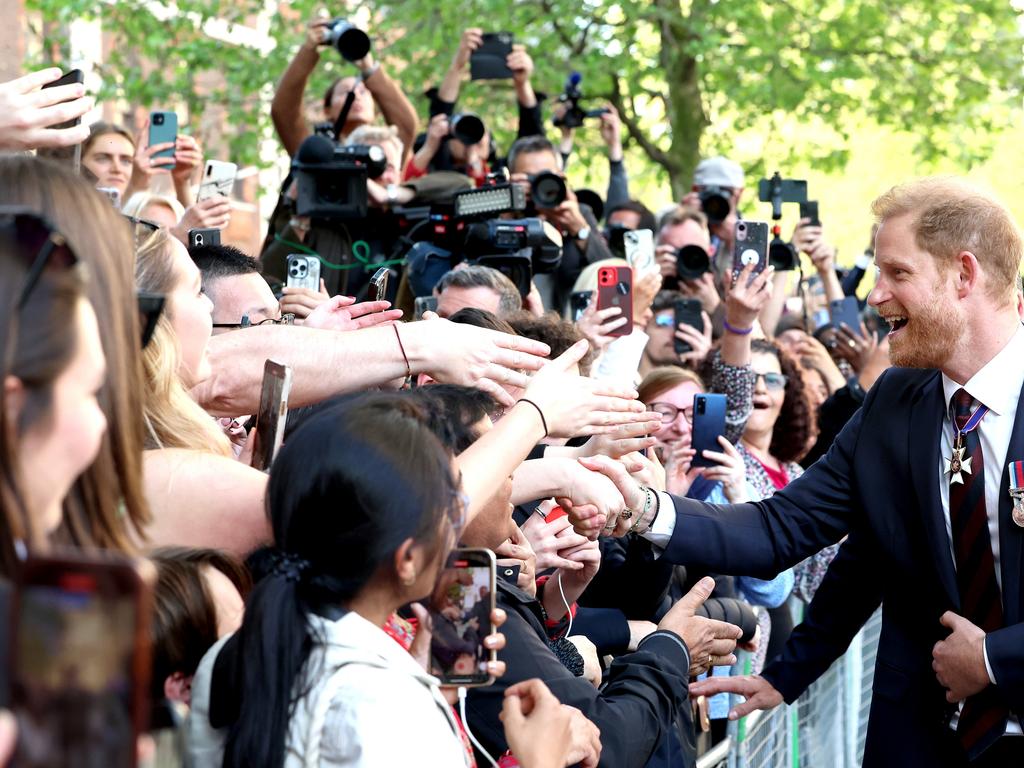 Prince Harry is greeted by fans outside the service. Picture: Getty Images