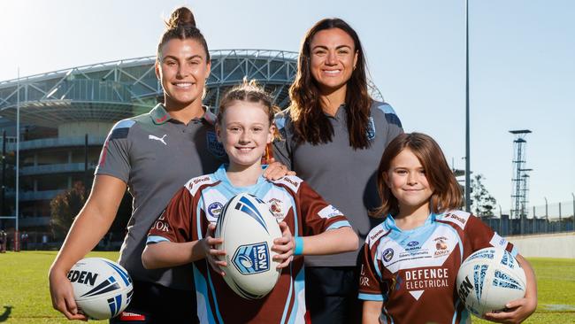 Sergis and Boyle with young fans, Imogen Wynne, 9, and Amelia Smart, 9. Picture: David Swift