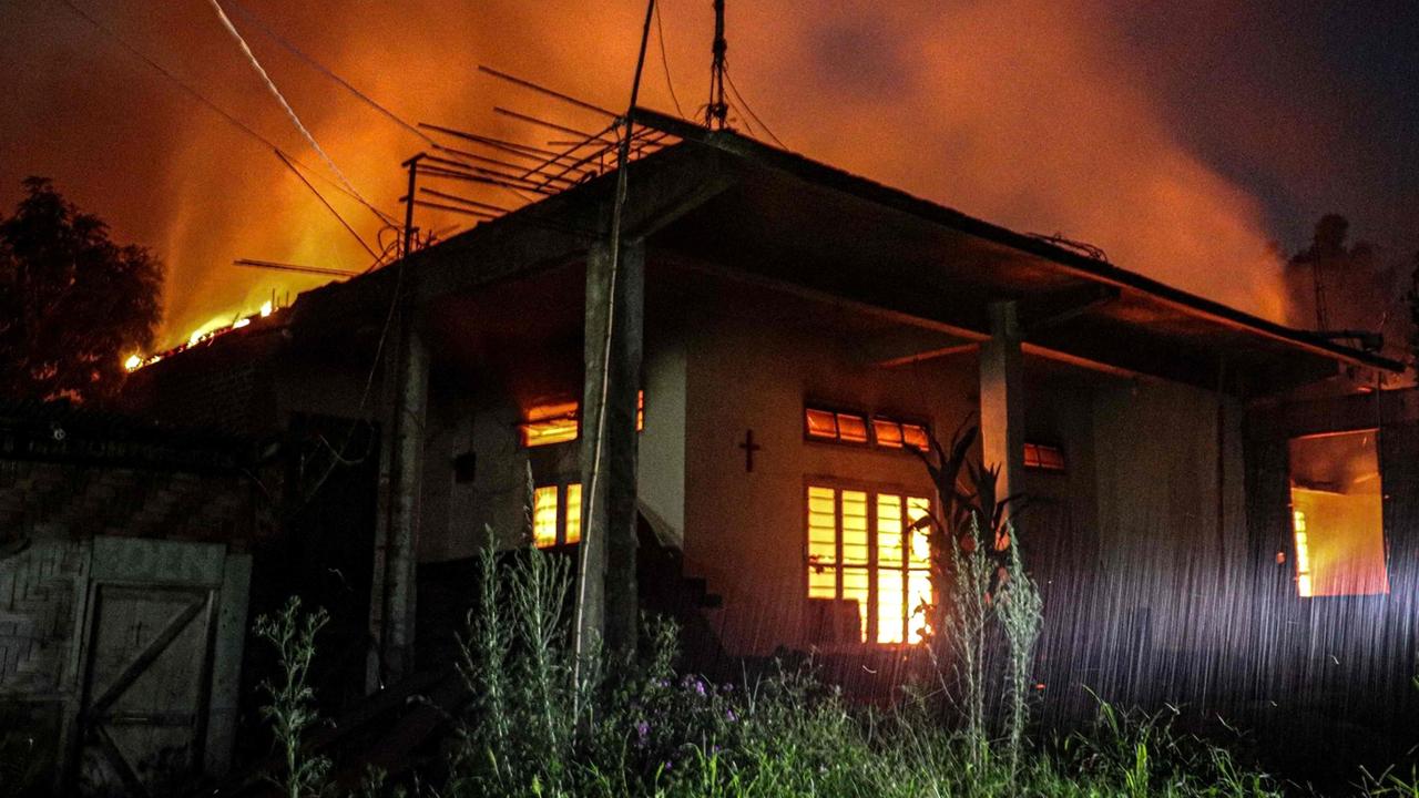 Smoke billows from an abandoned house set on fire in the violence-hit state of Manipur. Picture: AFP