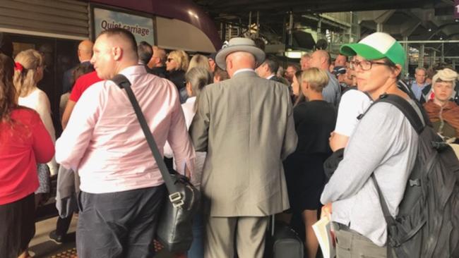 Commuters were forced to queue and sit on the floor after a number of V/Line services were cancelled. Picture: Supplied