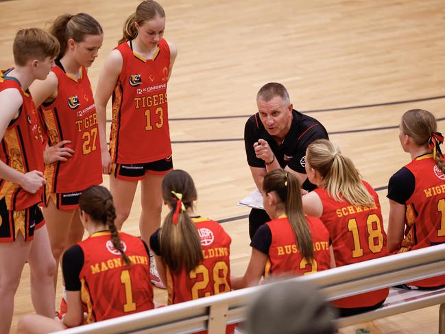 Melbourne Tigers coach Grant Francis talks with his squad on the sidelines at the Basketball Australia Under-18 Club Championships. Picture: Michael Farnell