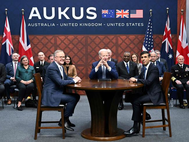 US President Joe Biden (C) participates in a trilateral meeting with British Prime Minister Rishi Sunak (R) and Australia's Prime Minister Anthony Albanese (L) during the AUKUS summit on March 13, 2023, at Naval Base Point Loma in San Diego California. - AUKUS is a trilateral security pact announced on September 15, 2021, for the Indo-Pacific region. (Photo by Jim WATSON / AFP)