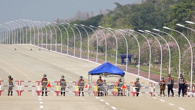 Soldiers stand guard on a blockaded road to Myanmar’s parliament in Naypyidaw after the military detained the country’s de facto leader Aung San Suu Kyi. Picture: AFP