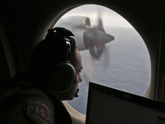 Flight officer Rayan Gharazeddine scans the water in the southern Indian Ocean off Australia from a Royal Australian Air Force AP-3C Orion during the 2014 search for the missing Malaysia Airlines Flight MH370. Picture: AP