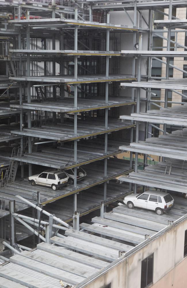 Vehicles imprisoned in a disused robotic car park for more than a decade are set to be preserved by demolition crews after work to redevelop the building got underway. Picture: SWNS/Mega