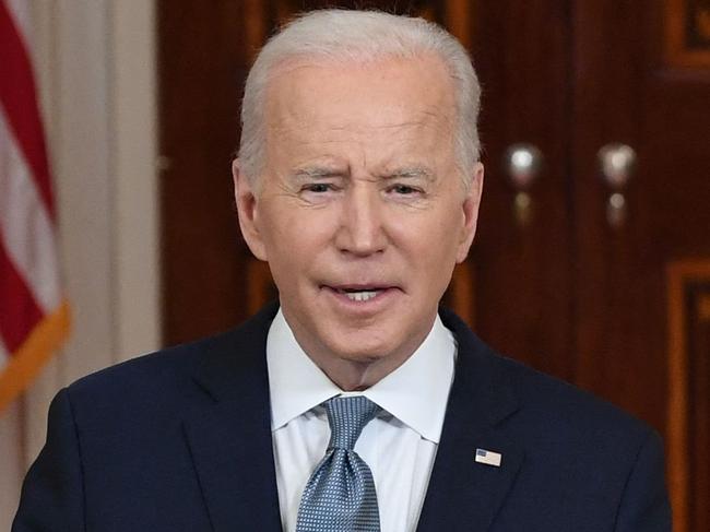 US President Joe Biden, with Vice President Kamala Harris (R), introduces his nominee for the US Supreme Court, Judge Ketanji Brown Jackson (L), at the White House in Washington, DC, on February 25, 2022. (Photo by SAUL LOEB / AFP)