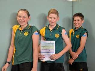 Elizabeth Roth, Hugh Funnell and Trader Ahern receive their immunisations at Burnett State Colege. Picture: Felicity Ripper