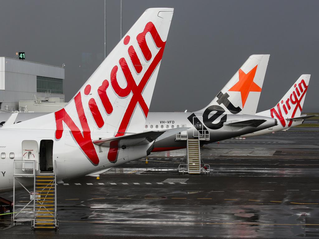 SYDNEY, AUSTRALIA - NewsWire Photos JUNE 28, 2021: Virgin and Jetstar Planes seen at Domestic Airport Terminal during the current Covid-19 Lockdown, Sydney Australia. Picture: NCA NewsWire / Gaye Gerard