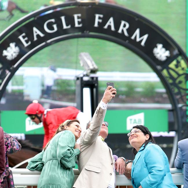 Premier Annastacia Palaszczuk, her partner Reza Adib and Grace Grace celebrate the Melbourne Cup at Eagle Farm. Picture: Steve Pohlner