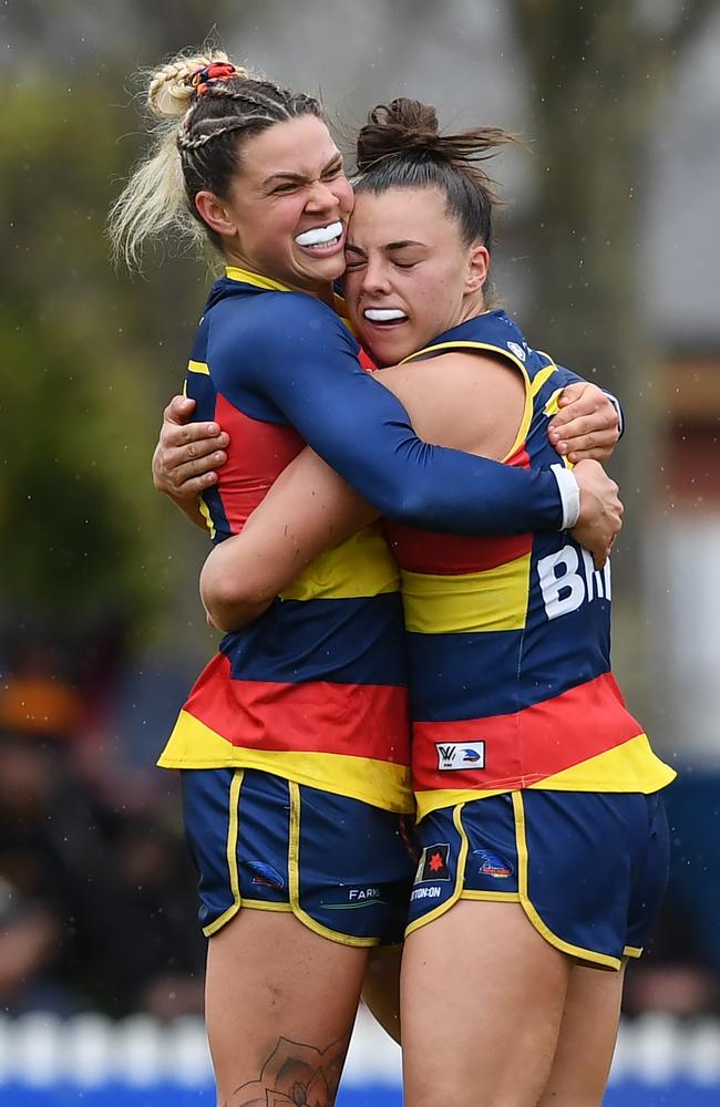 ADELAIDE, AUSTRALIA – SEPTEMBER 25: Anne Hatchard of the Crows celebrates a goal hugs Ebony Marinoff of the Crows during the round five AFLW match between the Adelaide Crows and the Greater Western Sydney Giants at Wigan Oval on September 25, 2022 in Adelaide, Australia. (Photo by Mark Brake/Getty Images)