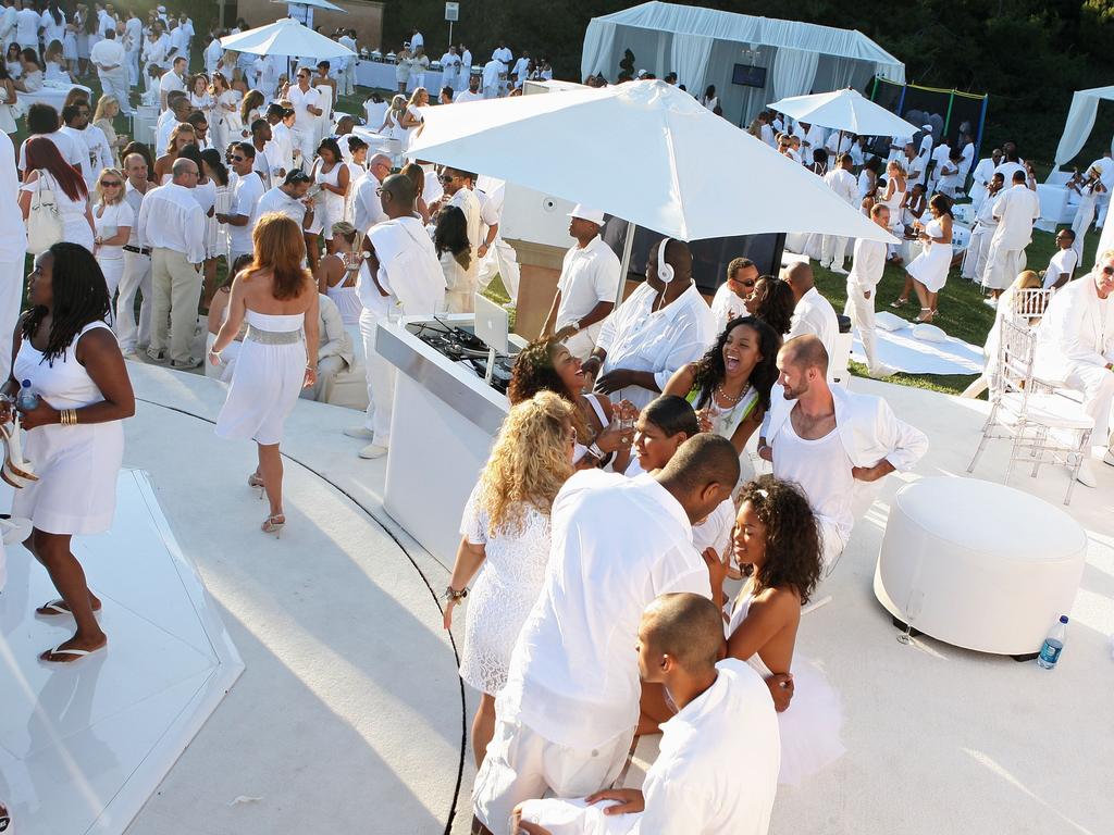 Guests mingle at another of Combs’ parties in 2009. Picture: Getty Images.