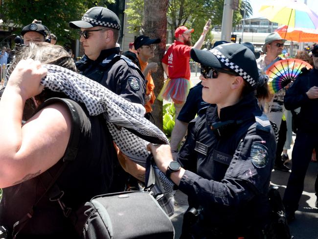 A small group of protesters clash with police who were marching in the Midsumma Pride Parade along Fitzroy Street St Kilda. Picture: Andrew Henshaw