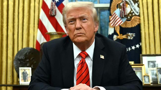 TOPSHOT - US President Donald Trump speaks to the press after signing an executive order in the Oval Office of the White House in Washington, DC, on February 10, 2025. (Photo by ANDREW CABALLERO-REYNOLDS / AFP)