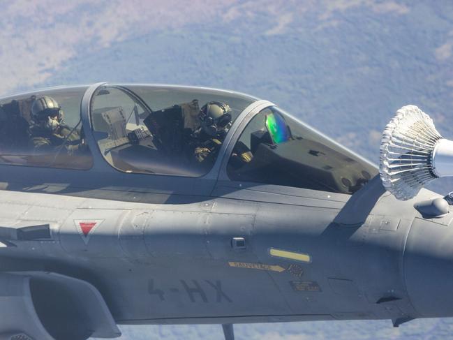 A French Rafale jet refuels mid-air about 100km south of Darwin. Picture: Floss Adams.