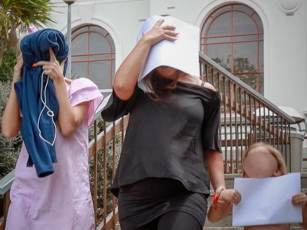 The trio pictured leaving court. Picture: Christine Cornege/NZ Herald