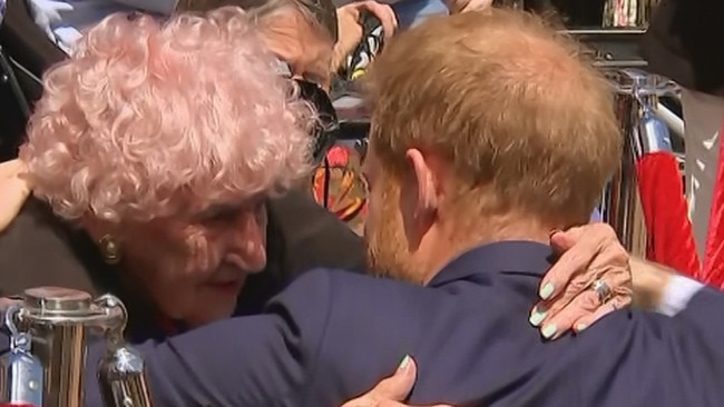 Daphne Dunne receives a heartfelt hug from Prince Harry.