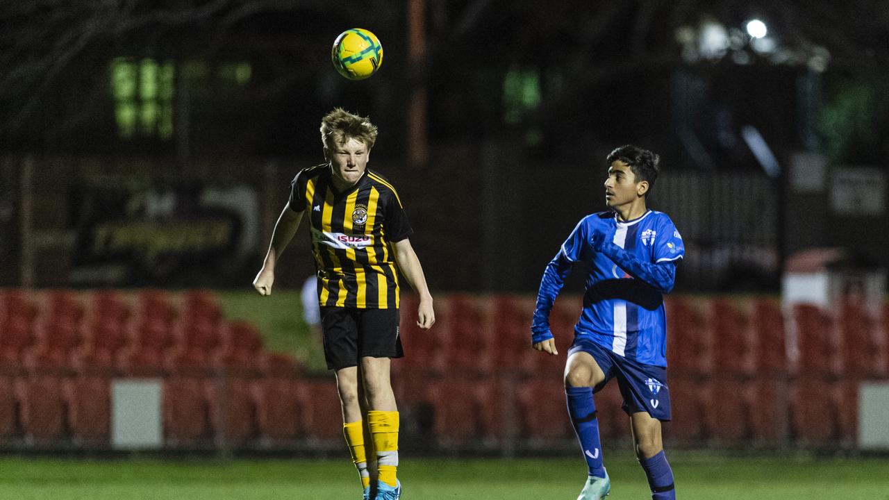 Jack Tyler of Football Dalby and Armanj Khalaf of Rockville Rovers Blue in Football Queensland Darling Downs Community Juniors U13 Div 1 White grand final at Clive Berghofer Stadium, Friday, August 30, 2024. Picture: Kevin Farmer