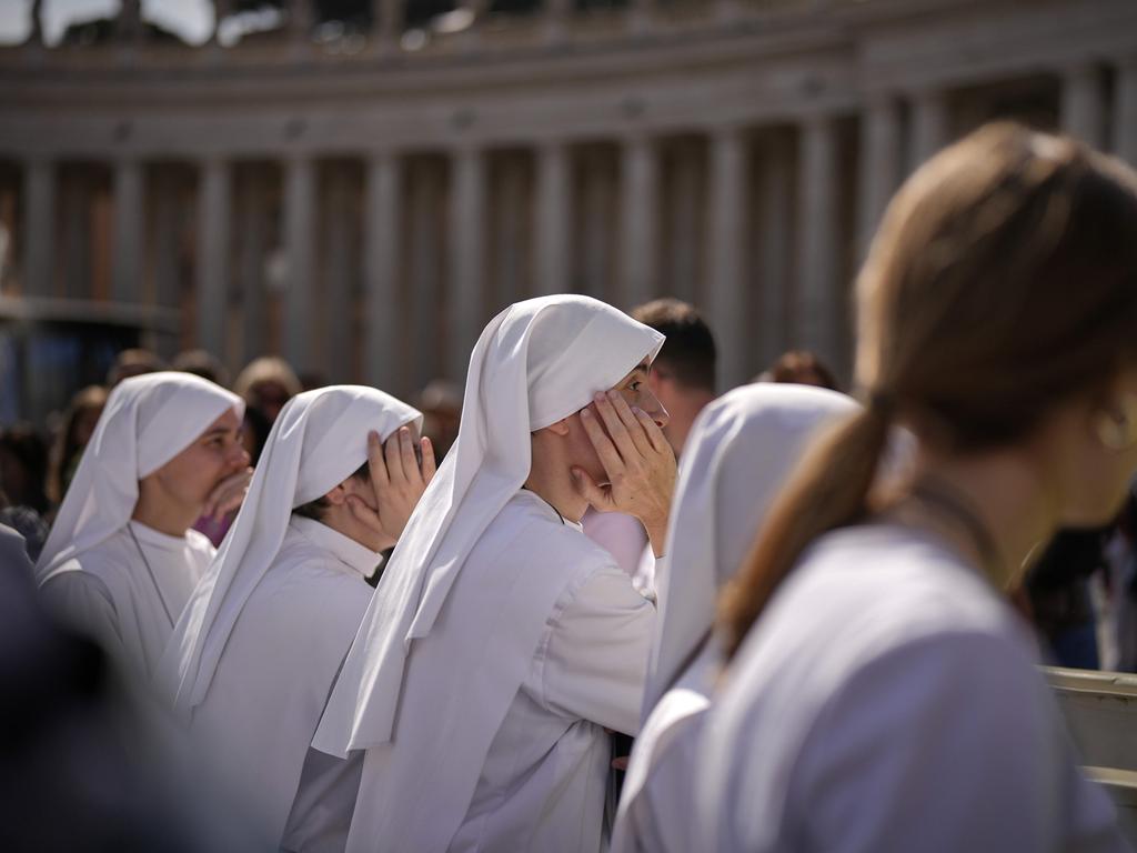 Nuns wait in St. Peter's Square to pay their respect to the late Pope Francis. Picture: AP