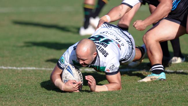 Former NRL playmaker Tyrone Roberts dives over for a try in the first half. Picture: DC Sports Photography