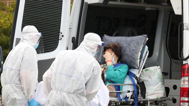 Residents are taken away from CraigCare aged care in Pascoe Vale in medical transport. Tuesday, August 4, 2020. Picture: David Crosling